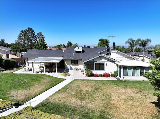 35632 Avocado St, Yucaipa, CA 92399 - rear view of property featuring a patio area, a yard, a sunroom, and stucco siding