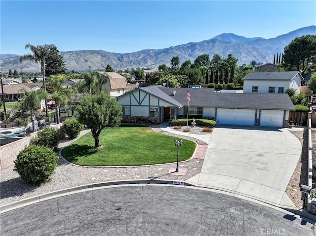 35632 Avocado St, Yucaipa, CA 92399 - view of front of property featuring a garage, driveway, and a mountain view