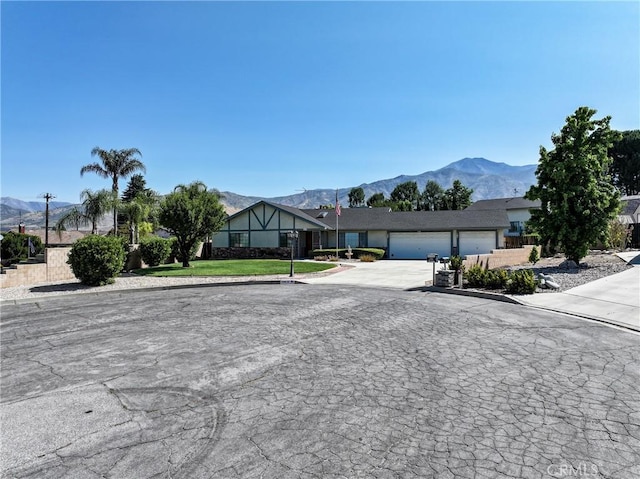 35632 Avocado St, Yucaipa, CA 92399 - view of asphalt road with a mountain view and curbs
