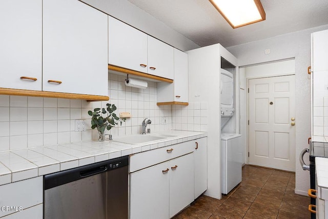 377 W California Ave, Glendale, CA 91203 - kitchen with stacked washer and clothes dryer, dishwasher, white cabinetry, backsplash, and tile counters