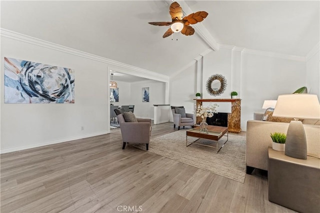 1626 Birchfield Dr, Tustin, CA 92780 - living area with a ceiling fan, light wood-style floors, and a fireplace with raised hearth