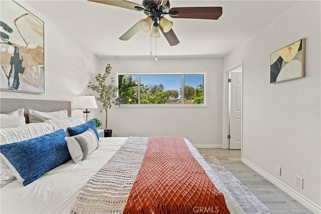1626 Birchfield Dr, Tustin, CA 92780 - bedroom with light wood-style floors and ceiling fan