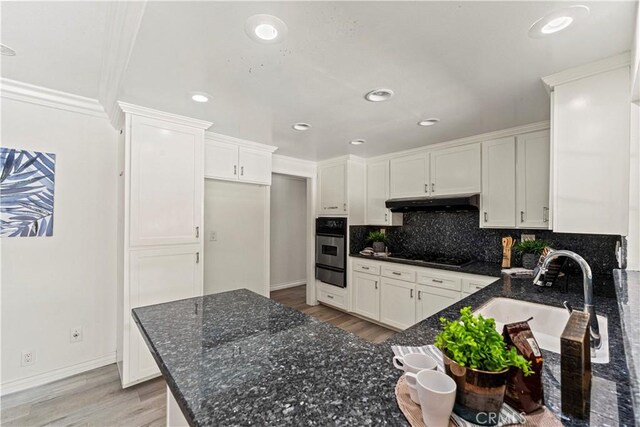 1626 Birchfield Dr, Tustin, CA 92780 - kitchen featuring oven, a warming drawer, light wood-style floors, white cabinetry, and recessed lighting