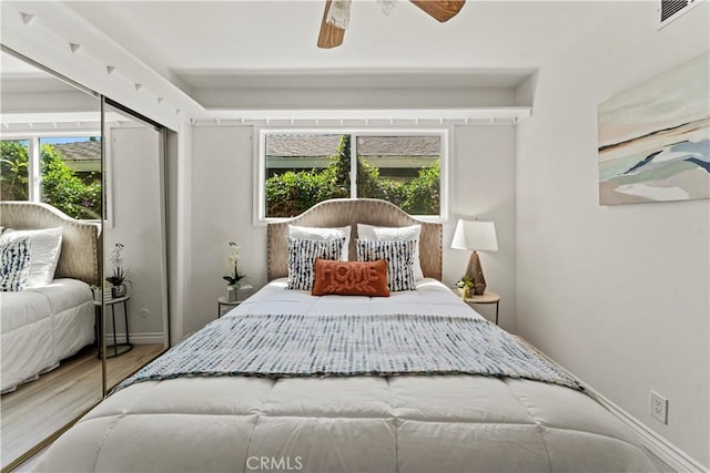 1626 Birchfield Dr, Tustin, CA 92780 - bedroom with multiple windows, wood finished floors, and ceiling fan
