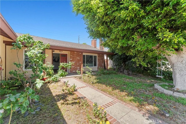 1626 Birchfield Dr, Tustin, CA 92780 - ranch-style house with a chimney and brick siding
