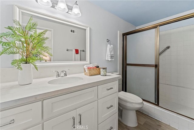 1626 Birchfield Dr, Tustin, CA 92780 - bathroom featuring a shower stall, vanity, and wood finished floors