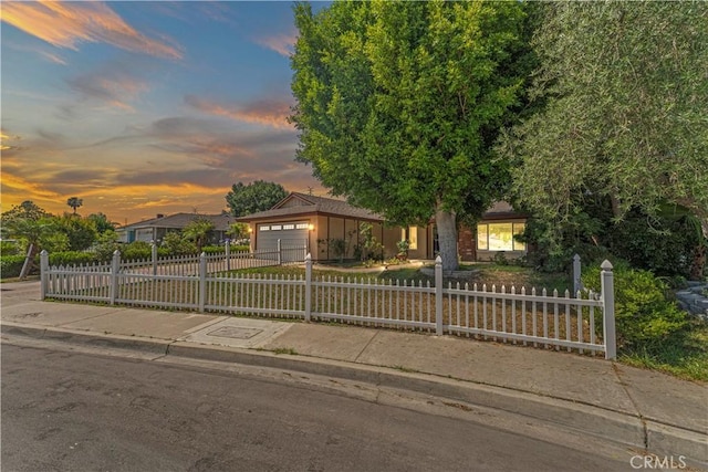 1626 Birchfield Dr, Tustin, CA 92780 - view of front of property featuring a fenced front yard, concrete driveway, and a garage