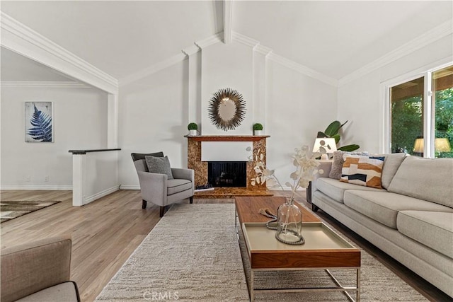 1626 Birchfield Dr, Tustin, CA 92780 - living room with a fireplace with raised hearth, wood finished floors, and crown molding