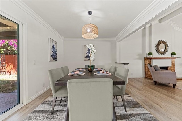 1626 Birchfield Dr, Tustin, CA 92780 - dining area featuring light wood finished floors and crown molding