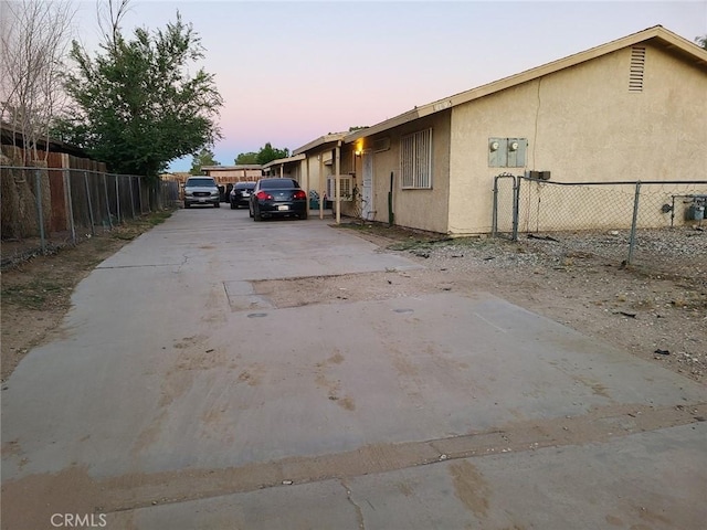 18605 New Hampshire St, Adelanto, CA 92301 - parking at dusk featuring concrete driveway