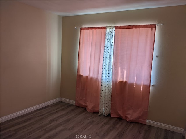 18605 New Hampshire St, Adelanto, CA 92301 - spare room featuring wood finished floors and baseboards
