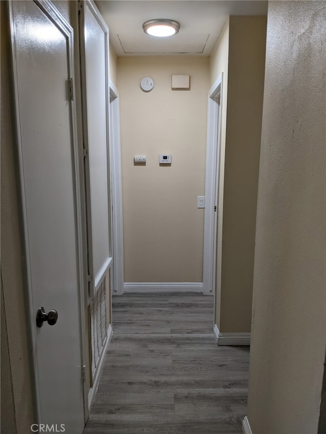 18605 New Hampshire St, Adelanto, CA 92301 - hallway featuring wood finished floors and baseboards