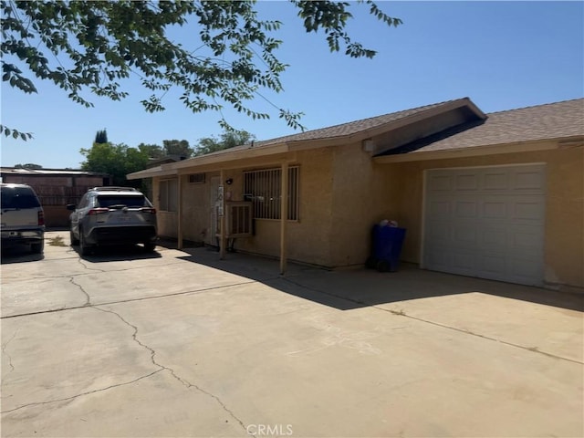 18605 New Hampshire St, Adelanto, CA 92301 - single story home featuring a garage, stucco siding, and concrete driveway