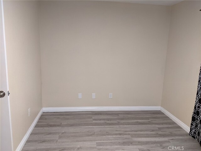 18605 New Hampshire St, Adelanto, CA 92301 - spare room featuring wood finished floors