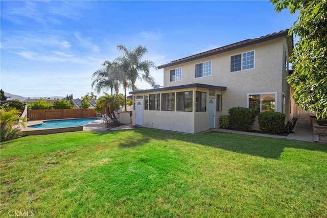 8609 Dunwoodie Rd, Santee, CA 92071 - rear view of house with a sunroom, stucco siding, and a fenced backyard