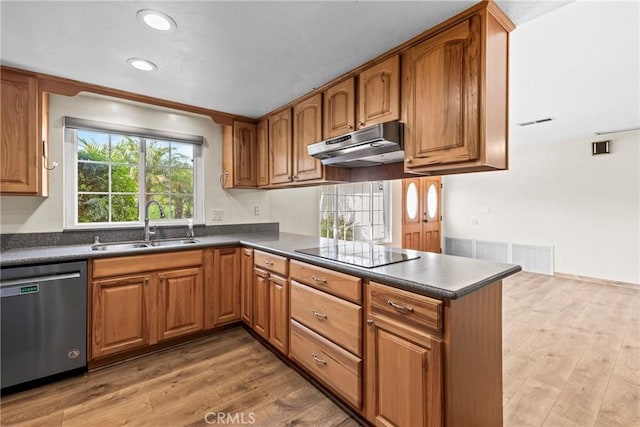 8609 Dunwoodie Rd, Santee, CA 92071 - kitchen with dishwasher, under cabinet range hood, black electric cooktop, dark countertops, and brown cabinetry