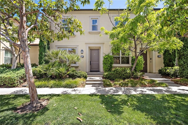 55 Jade Flower, Irvine, CA 92620 - multi unit property featuring stucco siding and a front lawn