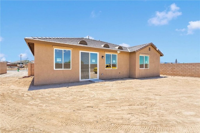 16112 Pablo Ct, Victorville, CA 92395 - rear view of property featuring stucco siding and a tiled roof