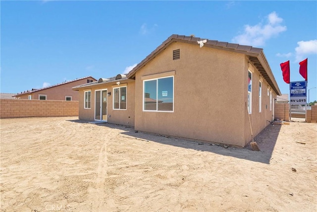 16112 Pablo Ct, Victorville, CA 92395 - back of house with a fenced backyard and stucco siding