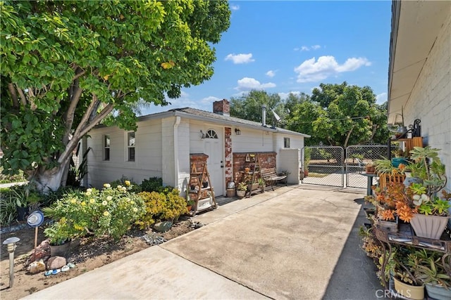 4840 Heleo Ave, Temple City, CA 91780 - view of side of home featuring a chimney and a gate