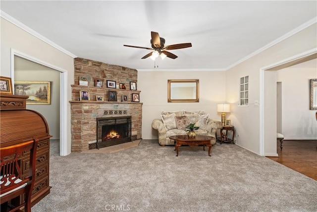 4840 Heleo Ave, Temple City, CA 91780 - living room featuring ceiling fan, ornamental molding, carpet flooring, and a large fireplace