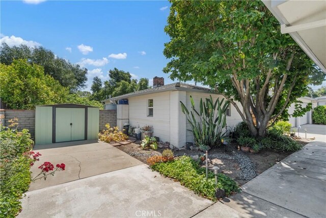 4840 Heleo Ave, Temple City, CA 91780 - view of side of home with a storage shed and a chimney