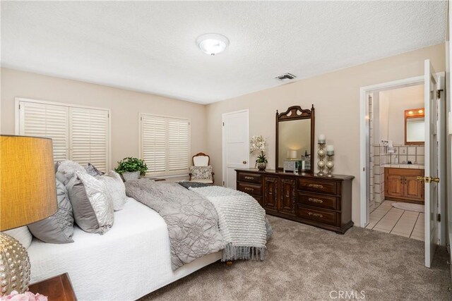 4840 Heleo Ave, Temple City, CA 91780 - bedroom with light colored carpet, connected bathroom, and light tile patterned floors