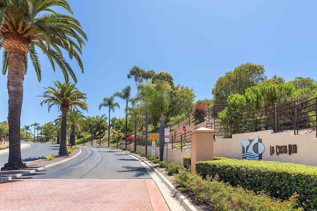 6970 Ballena Way Unit 50, Carlsbad, CA 92009 - view of asphalt street featuring curbs, traffic signs, and sidewalks