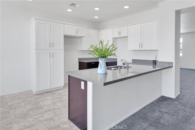 16124 Pablo Ct, Victorville, CA 92395 - kitchen featuring a peninsula, white cabinetry, recessed lighting, and light carpet