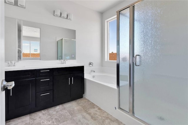 16124 Pablo Ct, Victorville, CA 92395 - full bath with healthy amount of natural light, a bath, double vanity, and a shower stall