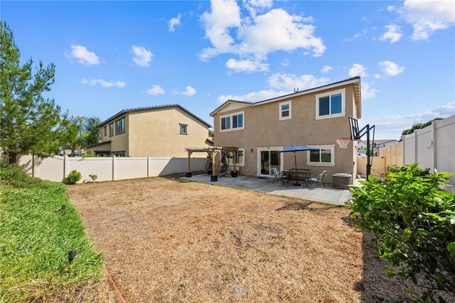 24212 Bay Laurel Ave, Murrieta, CA 92562 - back of property featuring a pergola, a fenced backyard, stucco siding, and a patio area