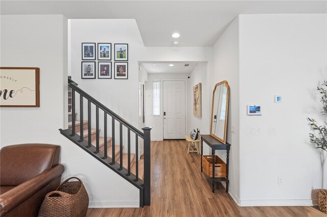 24212 Bay Laurel Ave, Murrieta, CA 92562 - entrance foyer featuring wood finished floors, recessed lighting, and stairs