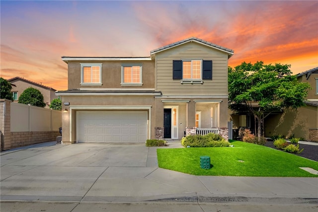 24212 Bay Laurel Ave, Murrieta, CA 92562 - traditional home with covered porch, an attached garage, concrete driveway, and stucco siding