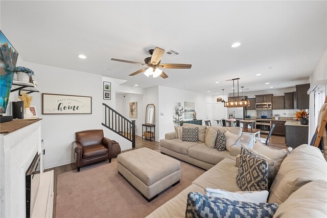 24212 Bay Laurel Ave, Murrieta, CA 92562 - living room featuring recessed lighting, stairs, ceiling fan, a fireplace, and wood finished floors