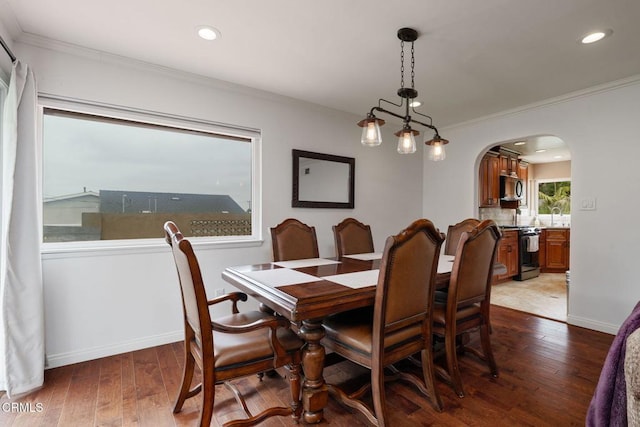 872 Via Arroyo, Ventura, CA 93003 - dining room featuring arched walkways, dark wood finished floors, crown molding, and recessed lighting