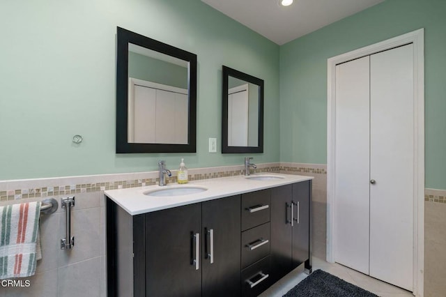 872 Via Arroyo, Ventura, CA 93003 - bathroom featuring tile walls, double vanity, a wainscoted wall, tile patterned floors, and recessed lighting