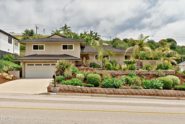872 Via Arroyo, Ventura, CA 93003 - view of front of house with stucco siding, concrete driveway, a garage, and a tiled roof