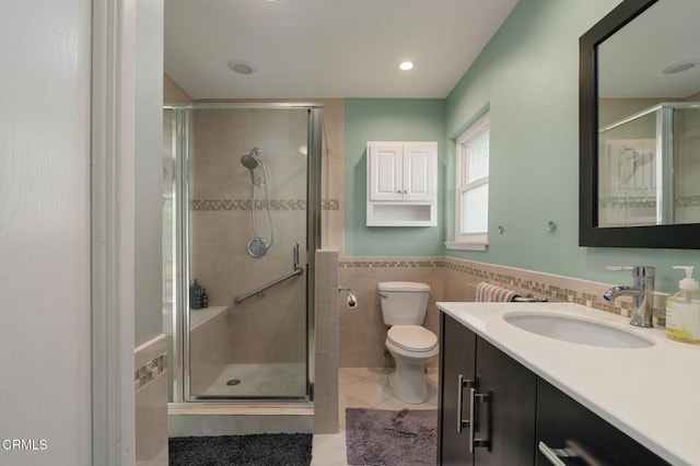 872 Via Arroyo, Ventura, CA 93003 - bathroom featuring vanity, a stall shower, tile patterned flooring, tile walls, and a wainscoted wall