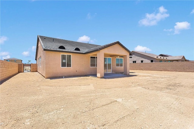 16148 Pablo Ct, Victorville, CA 92395 - rear view of property with a patio, a fenced backyard, stucco siding, and a gate