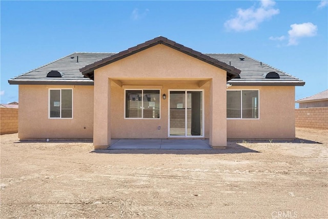 16148 Pablo Ct, Victorville, CA 92395 - back of house featuring stucco siding, a patio area, and a tiled roof
