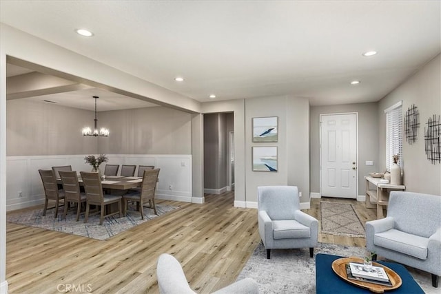 32669 Armoise Dr, Winchester, CA 92596 - living room featuring wood finished floors, a chandelier, recessed lighting, and a wainscoted wall