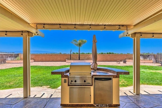 32669 Armoise Dr, Winchester, CA 92596 - fenced backyard featuring a patio and exterior kitchen