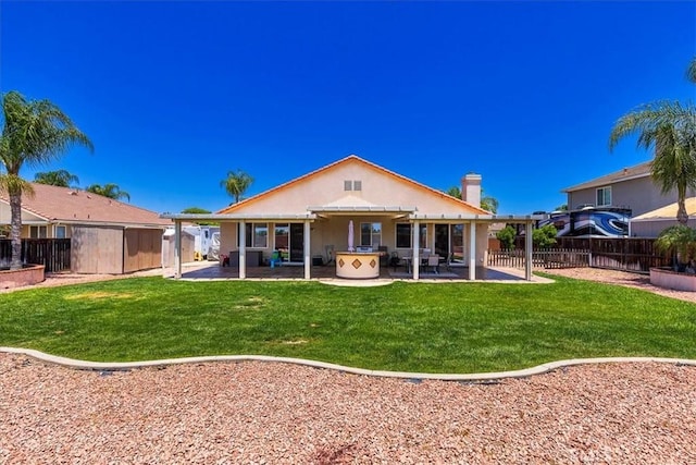 32669 Armoise Dr, Winchester, CA 92596 - rear view of house with a fenced backyard, a patio, and stucco siding