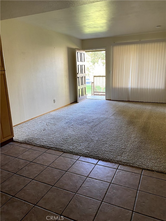 9649 Spyglass Ave Unit 94, Desert Hot Springs, CA 92240 - carpeted empty room with tile patterned flooring