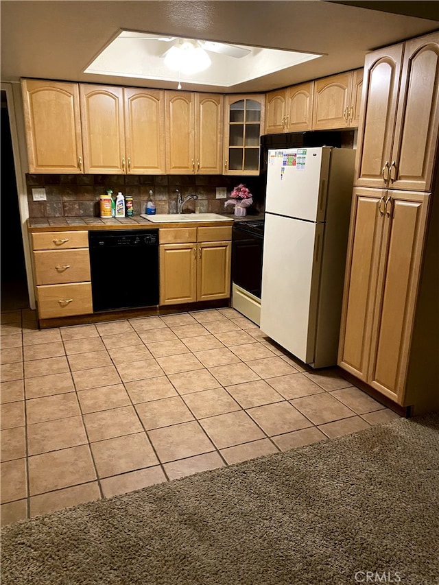 9649 Spyglass Ave Unit 94, Desert Hot Springs, CA 92240 - kitchen featuring black dishwasher, freestanding refrigerator, electric stove, and light brown cabinetry