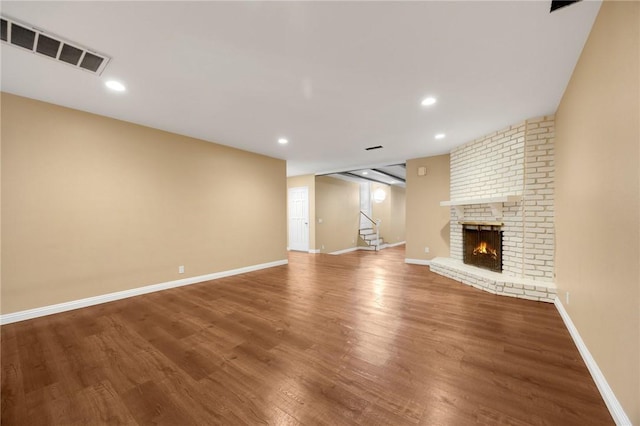 4159 Redline Dr, Lakewood, CA 90713 - unfurnished living room with wood finished floors, stairway, recessed lighting, and a fireplace