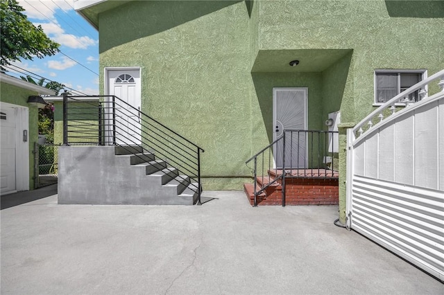 4159 Redline Dr, Lakewood, CA 90713 - property entrance featuring stucco siding and a patio area
