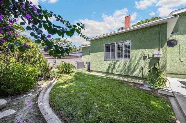 4159 Redline Dr, Lakewood, CA 90713 - view of side of property featuring a chimney and stucco siding