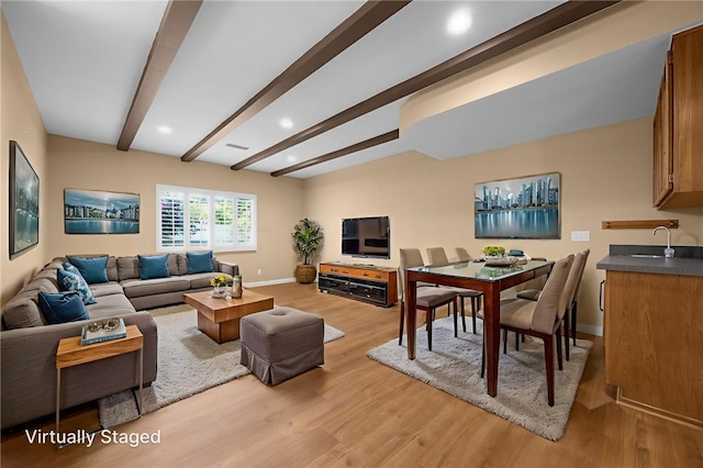 4159 Redline Dr, Lakewood, CA 90713 - living area with light wood finished floors, beamed ceiling, and recessed lighting