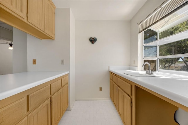 4159 Redline Dr, Lakewood, CA 90713 - kitchen featuring light countertops, light brown cabinets, and light flooring